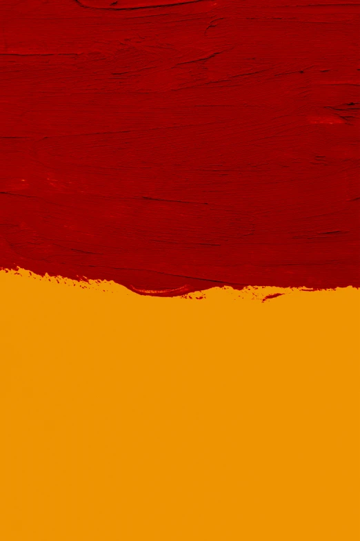 red and yellow painted on wood with a light shining in it