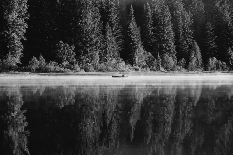 an image of a person on a canoe in the lake