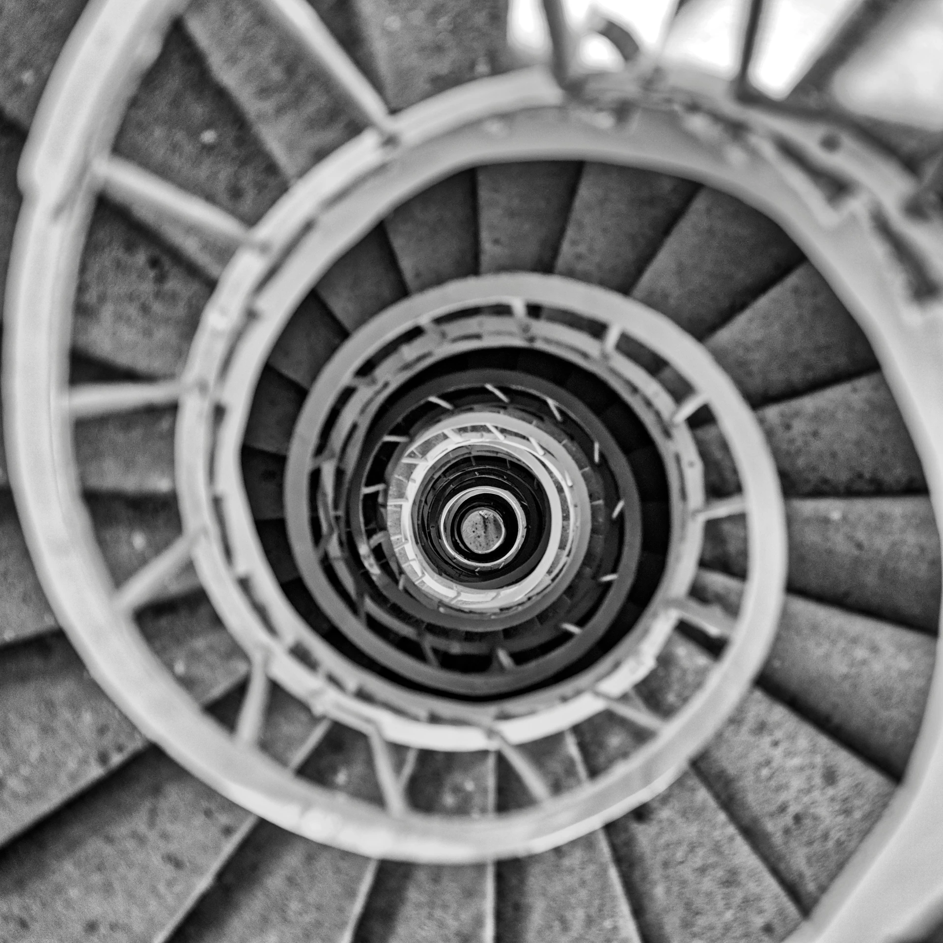 a spiral staircase in black and white