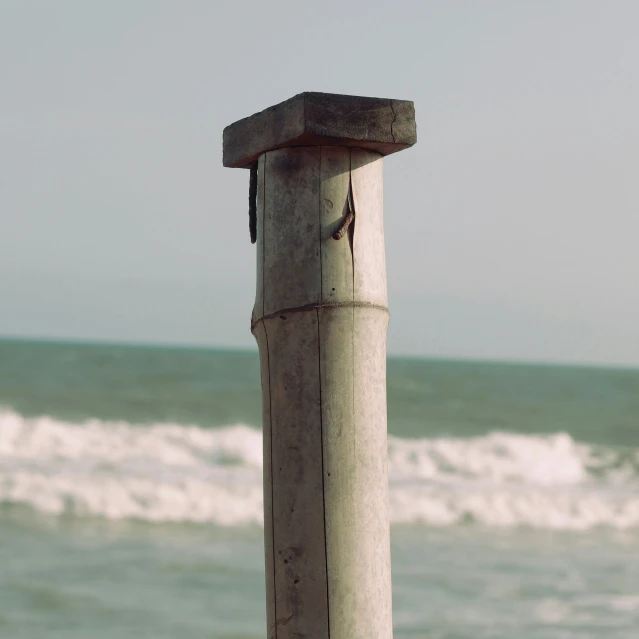 the ocean has very strong waves crashing up behind it