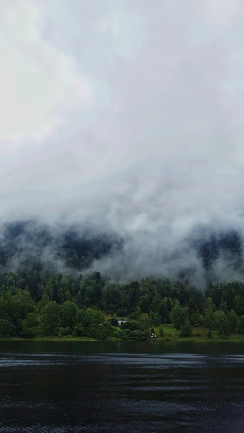 the mountain is in the distance and it has mist