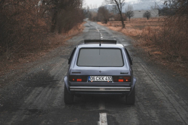 a car is parked in front of a road