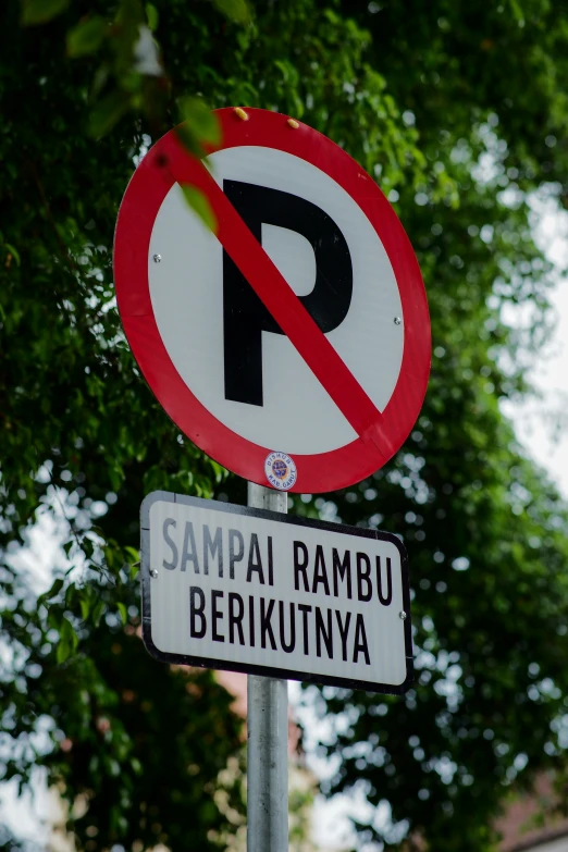 a pole with some traffic signs on it