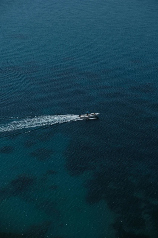 a boat sailing through the ocean water