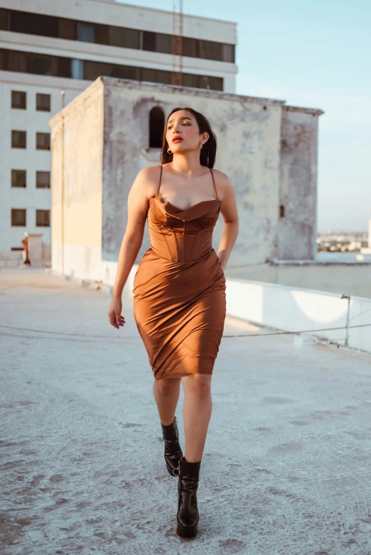 a woman is walking in front of a white building