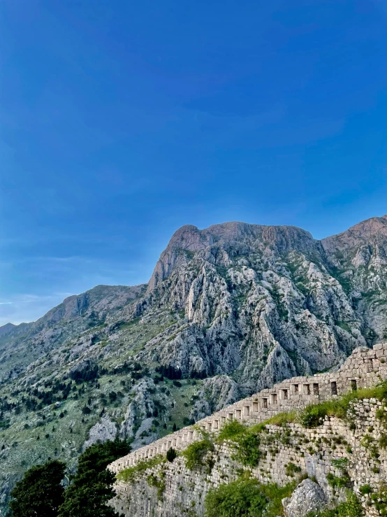 mountain scene with some big rocks and trees