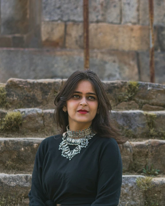 a girl posing by steps for a picture