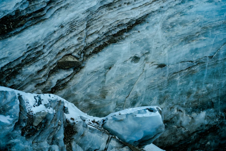 the snow on the rocks is covering all the way to the top