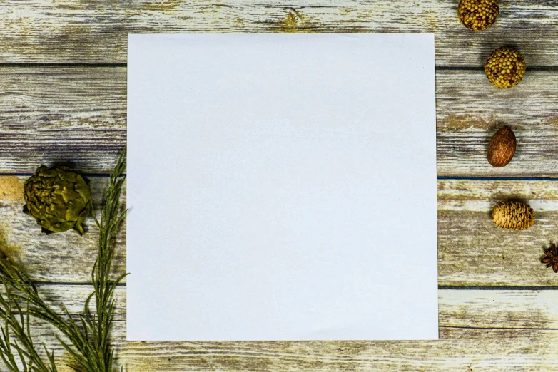 a white paper placed on top of a wood table