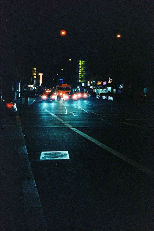 a street with some traffic on it at night