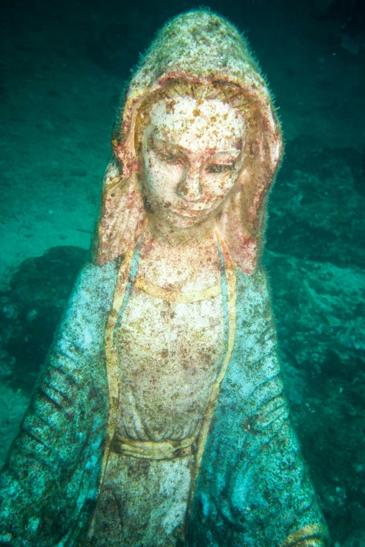 a beautiful sculpture sits on the water in front of the camera