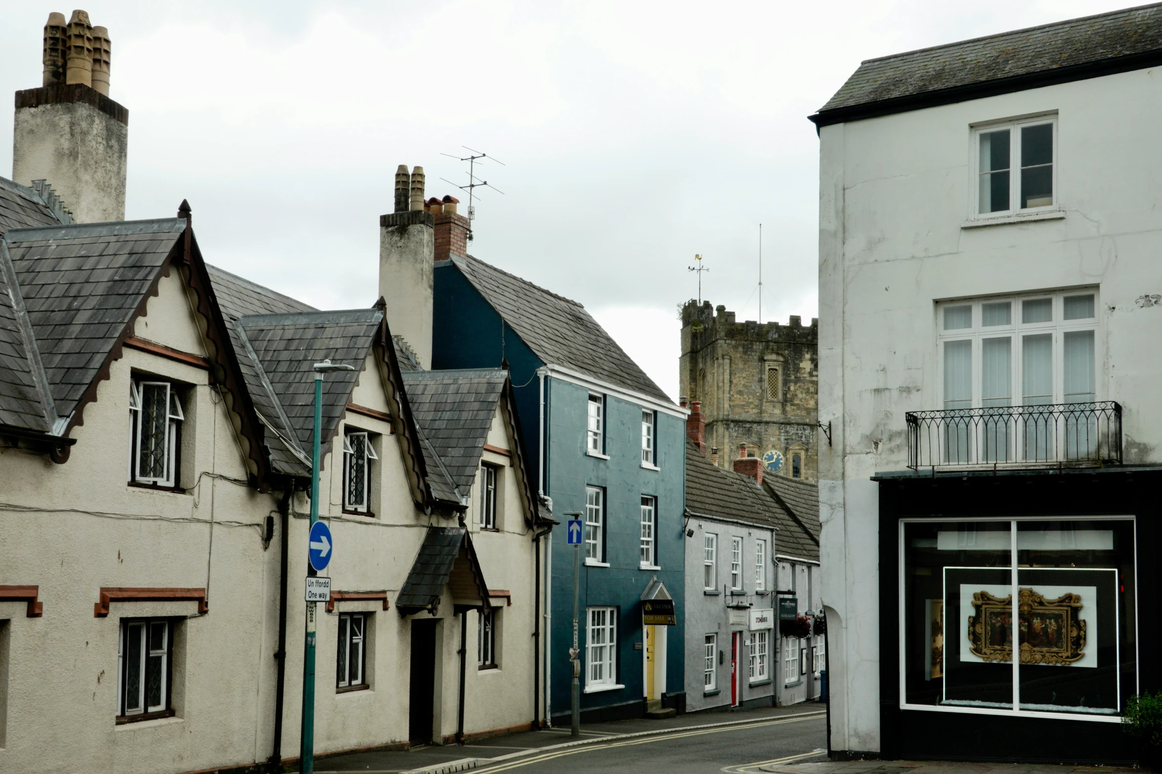 a few buildings next to each other on a street