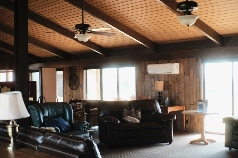 a living room with couches and lamps