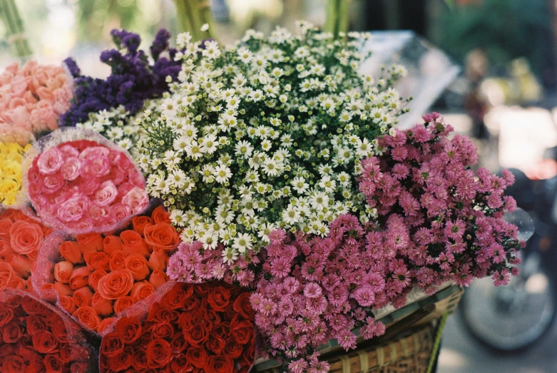 many flowers are in a wicker basket