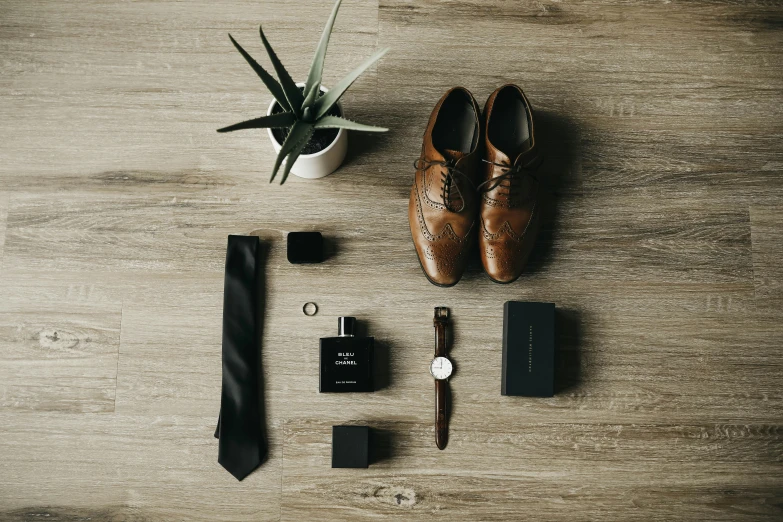 shoes, keys and accessories are on the table