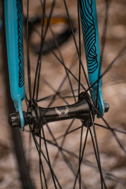 this bike is painted blue and features a wheel