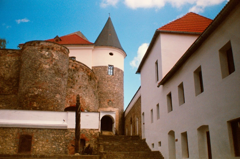 there is a castle in the background with stairs leading up to it