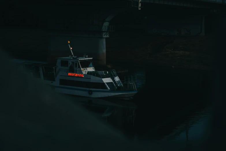 a large white boat tied to a metal rail