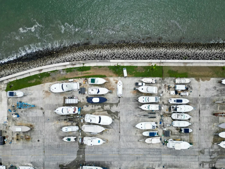 a couple of boats are parked in a lot