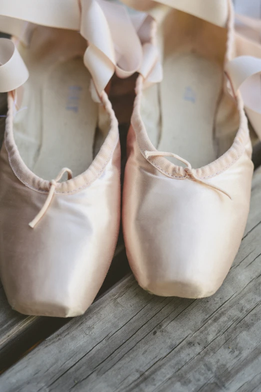 a close up s of ballerinas with bows on them