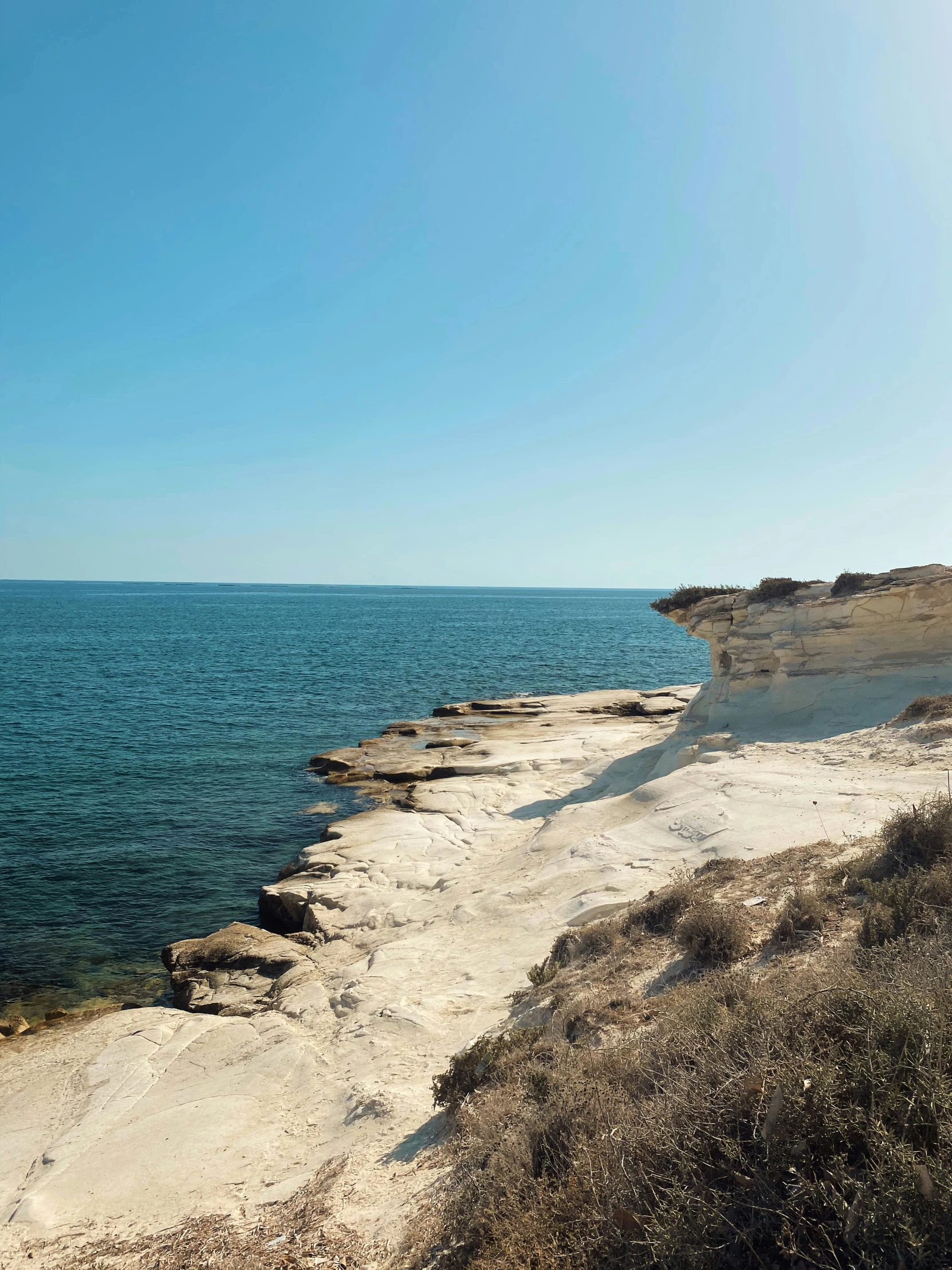 beach scene with blue sky and clear water