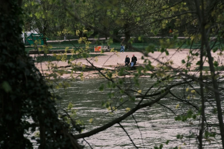 two people riding horses down the river