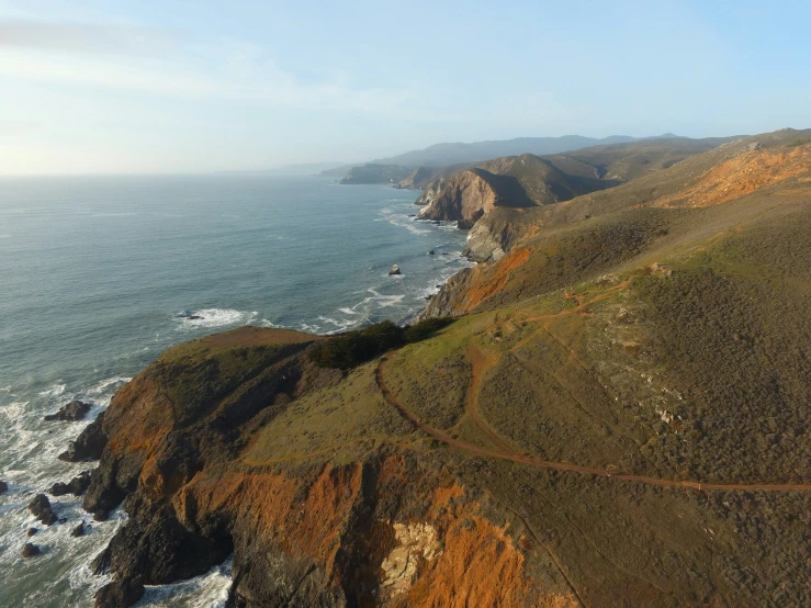 a road passes over a steep rocky cliff