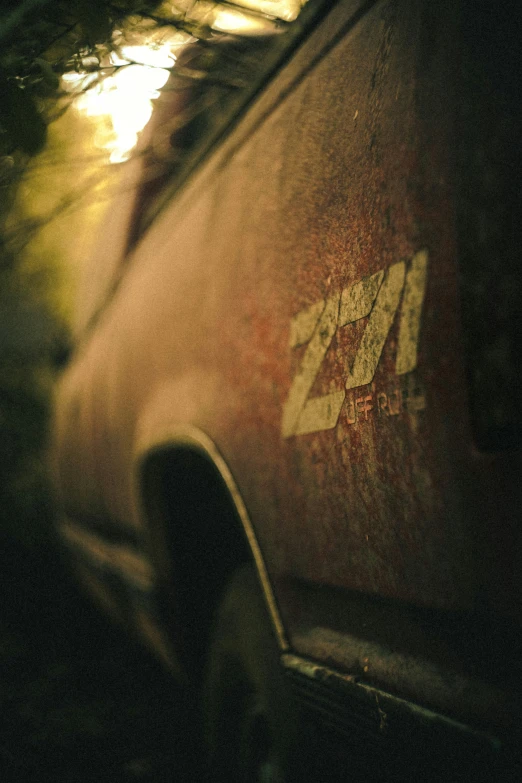 an old rusty vehicle has a yellow arrow