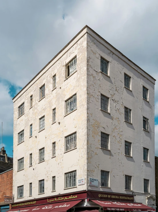 a white building is on a city street