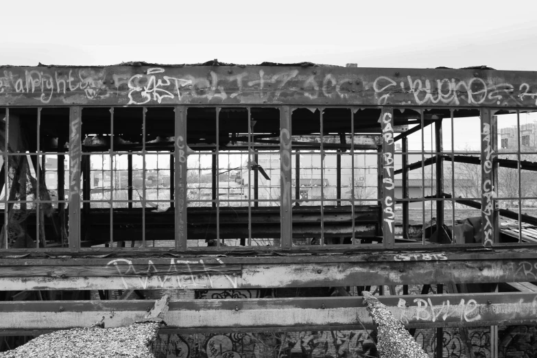 black and white pograph of an old dilapidated bridge