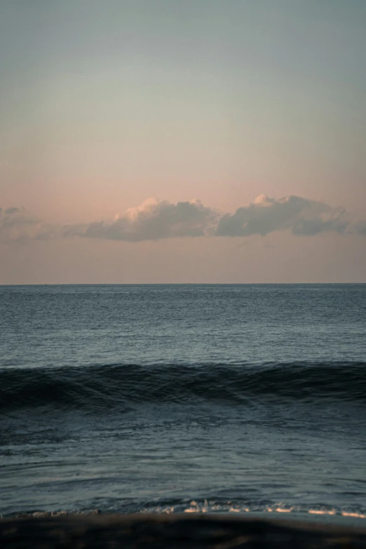 a boat sits in the distance on a large body of water