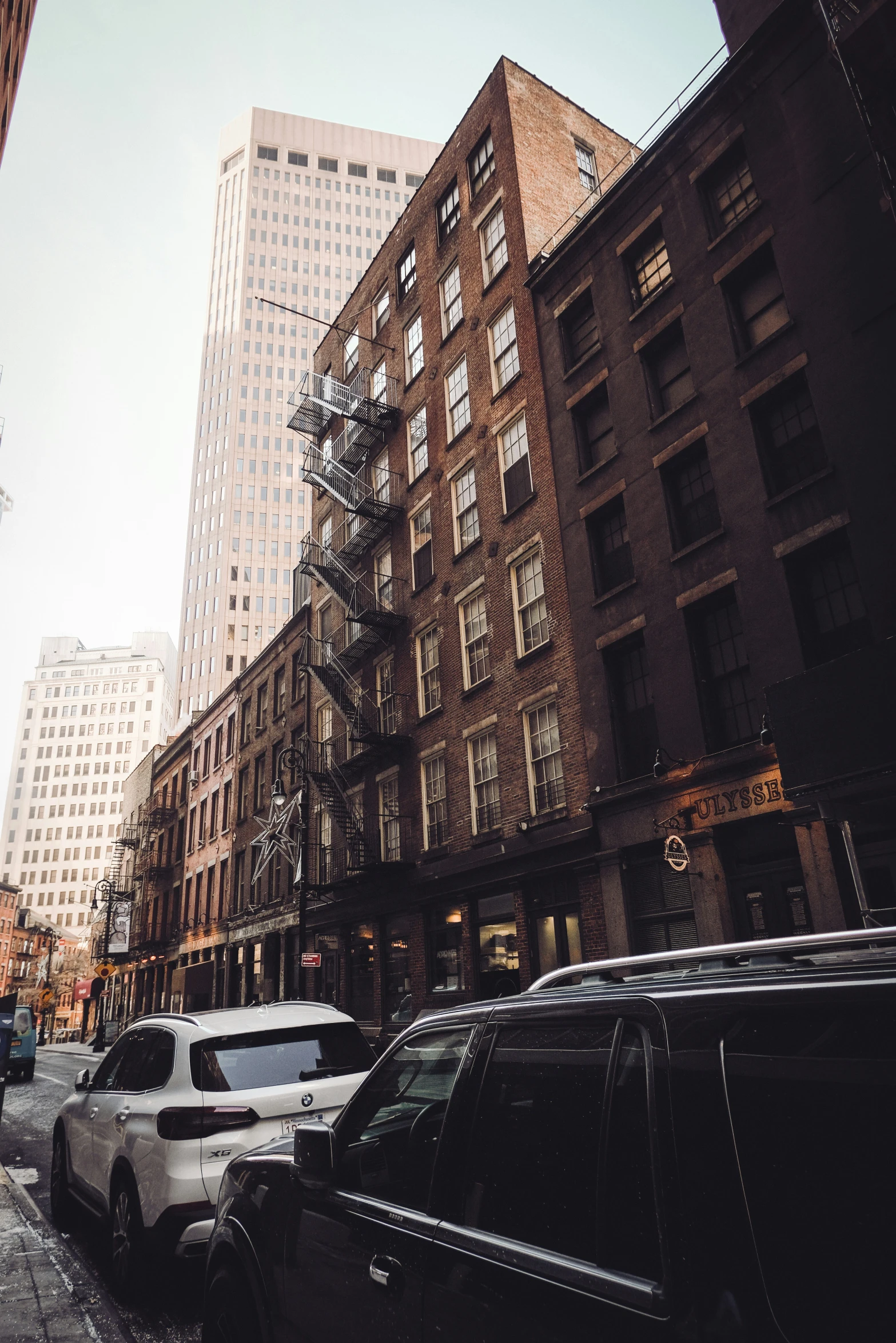 many cars and some buildings in a city