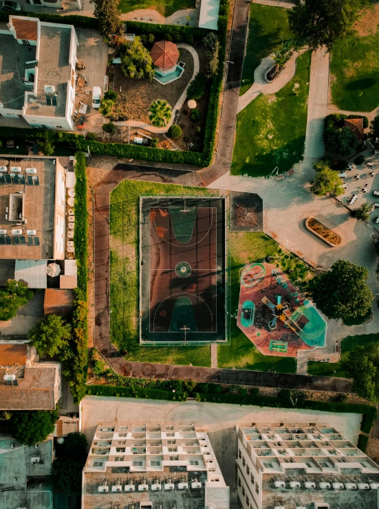 an aerial view of tennis courts and buildings