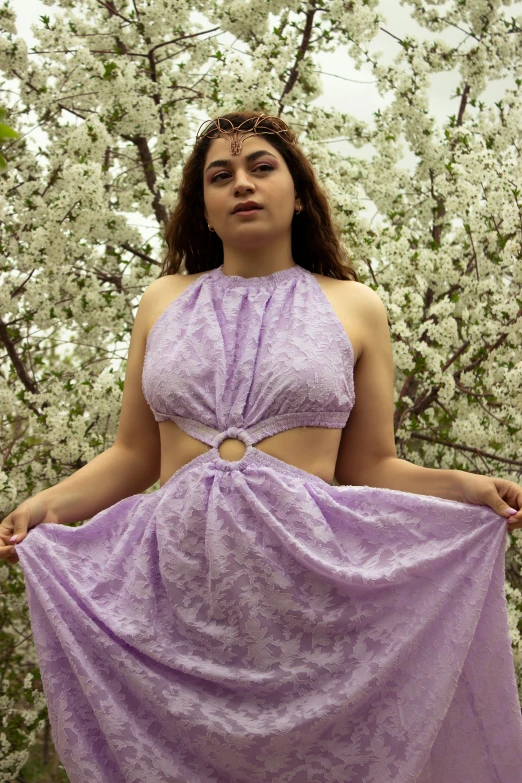 young woman wearing lavender evening gown, with open neck
