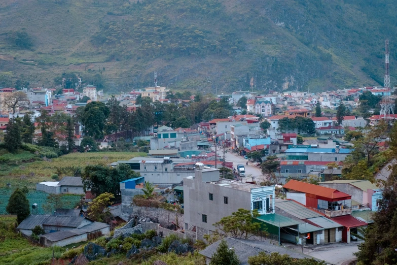 an aerial view of a small city surrounded by mountains