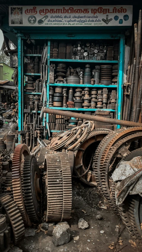 large set of metal wheels sit in front of a store