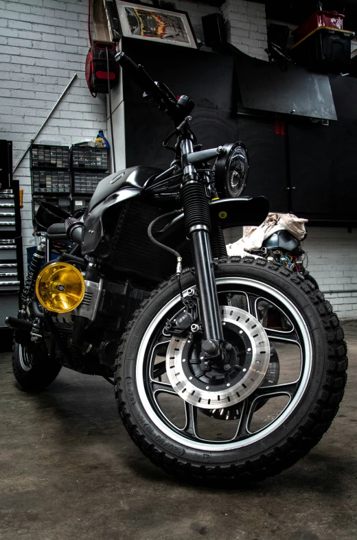 a bike is sitting on the ground in the garage