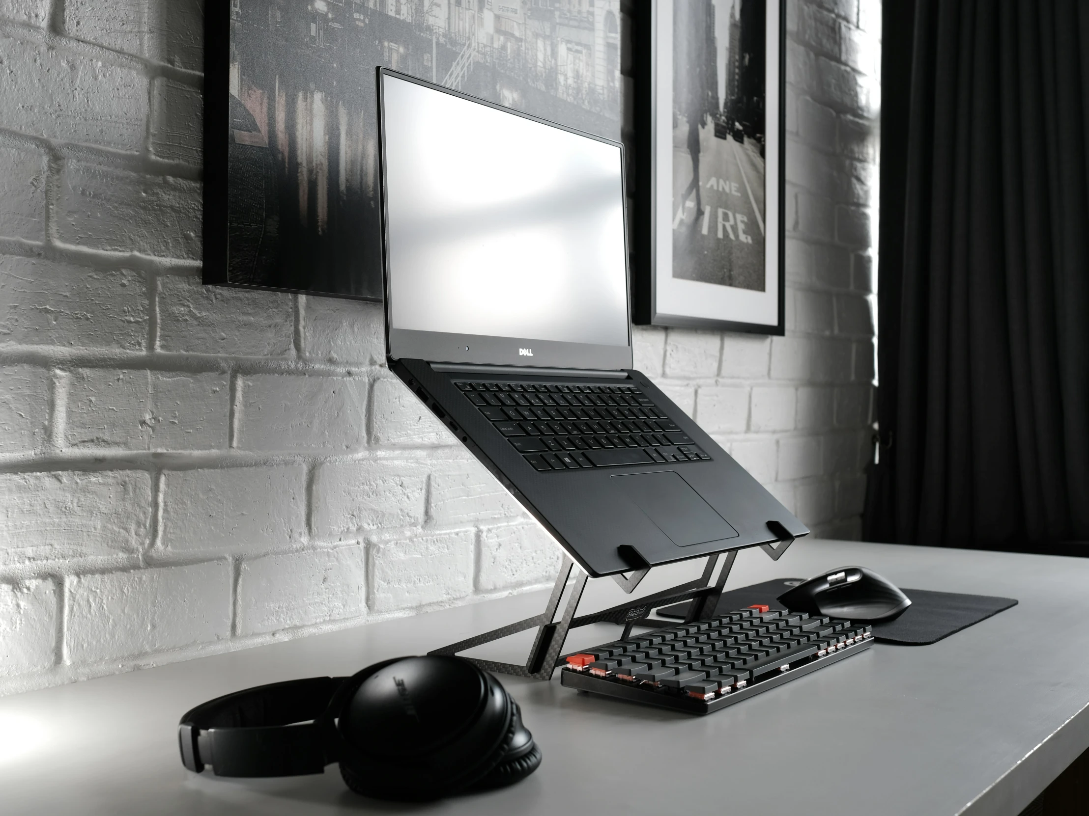 a computer and headphones sitting on top of a desk