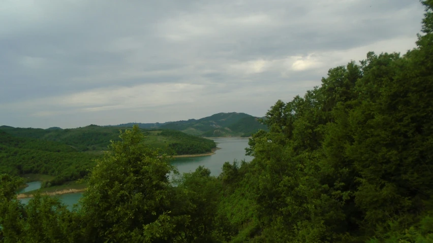 the view from a hill across a river