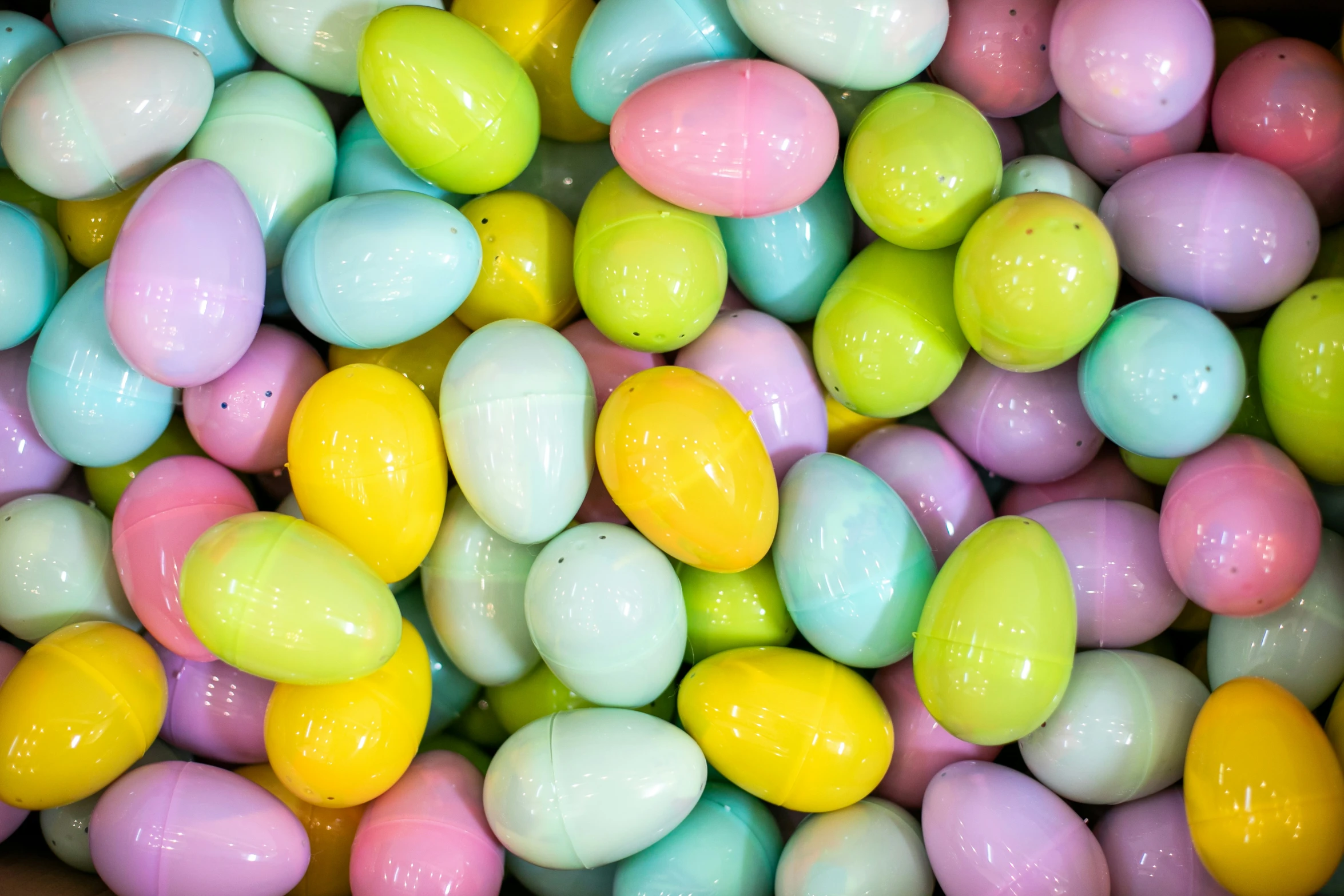 a bowl filled with different colored eggs