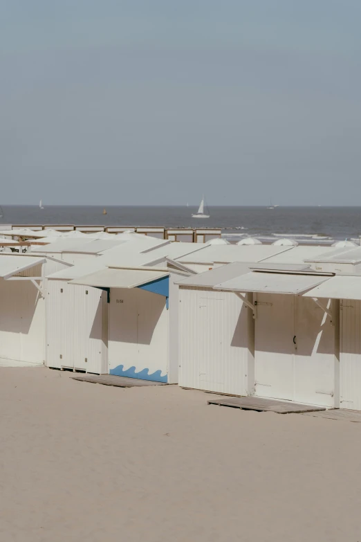 rows of white building at beach near ocean