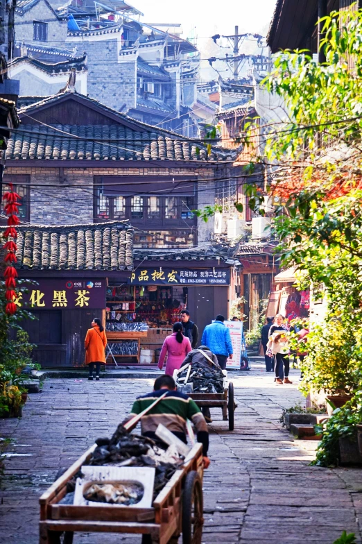 a small street with an open cart parked next to a building