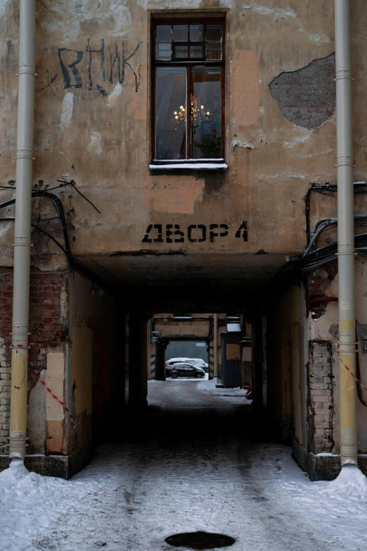 an entrance to a building with snow on the ground