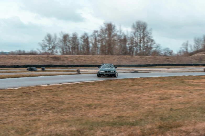 there is a small car that is going around a track