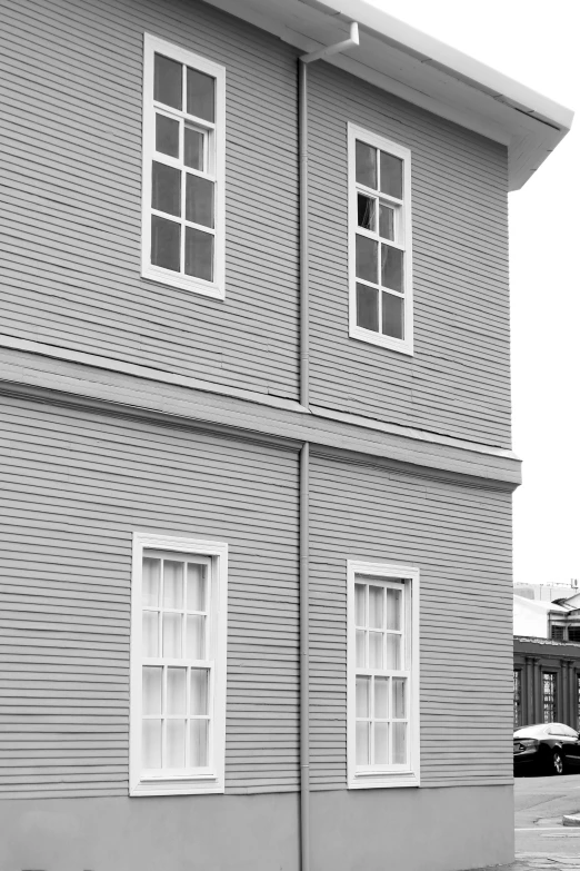 black and white po of a building with three windows