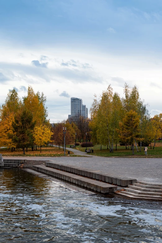 there is a bench and some steps on the water