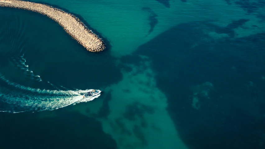 an aerial view of a wave on the ocean