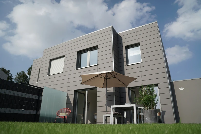 an empty patio with an umbrella on top