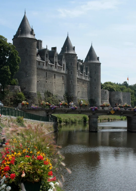 a castle on a lake is surrounded by water