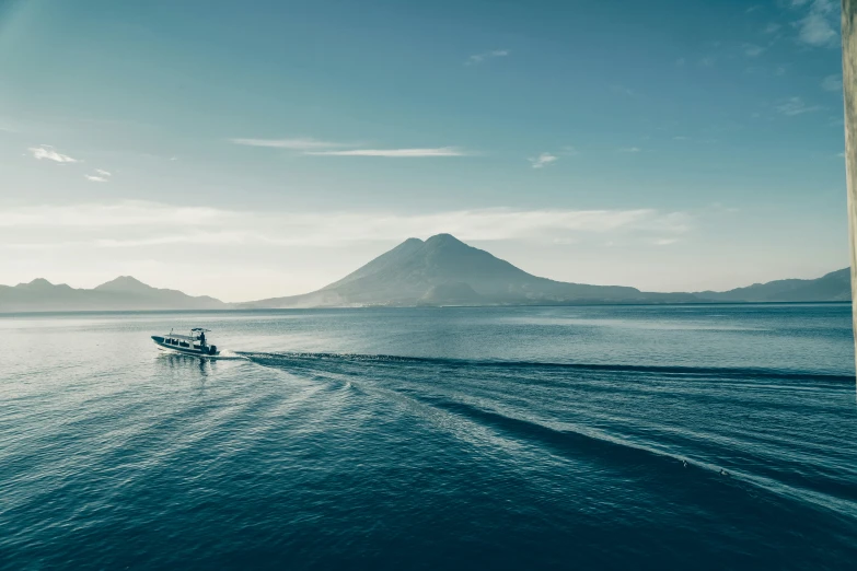 the lone boat is in the water on the water